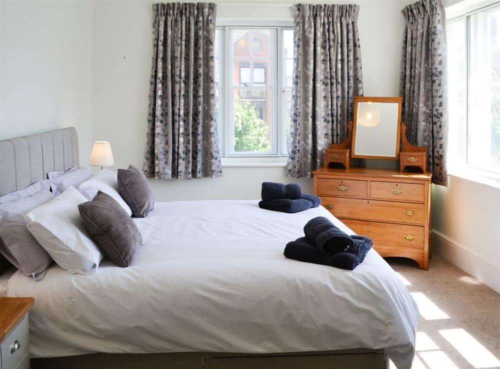 Romantic and inviting double bedroom with super kingsize bed at Three The Boulevard in Sheringham, Norfolk, England
