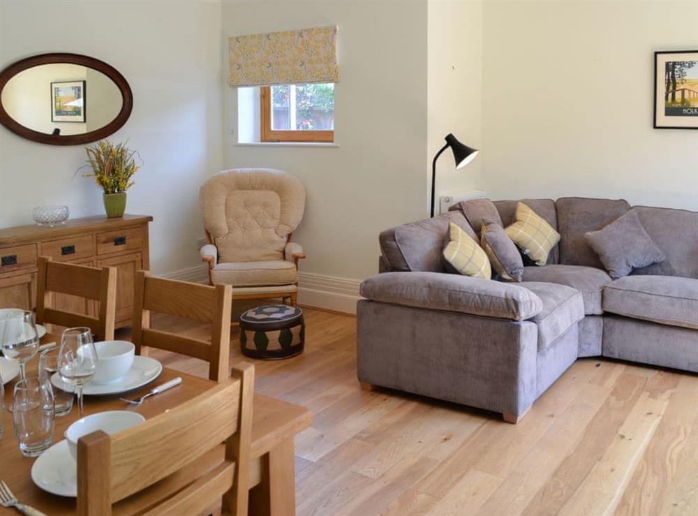 Well-appointed living/dining room with comfortable furniture at Three The Boulevard in Sheringham, Norfolk, England