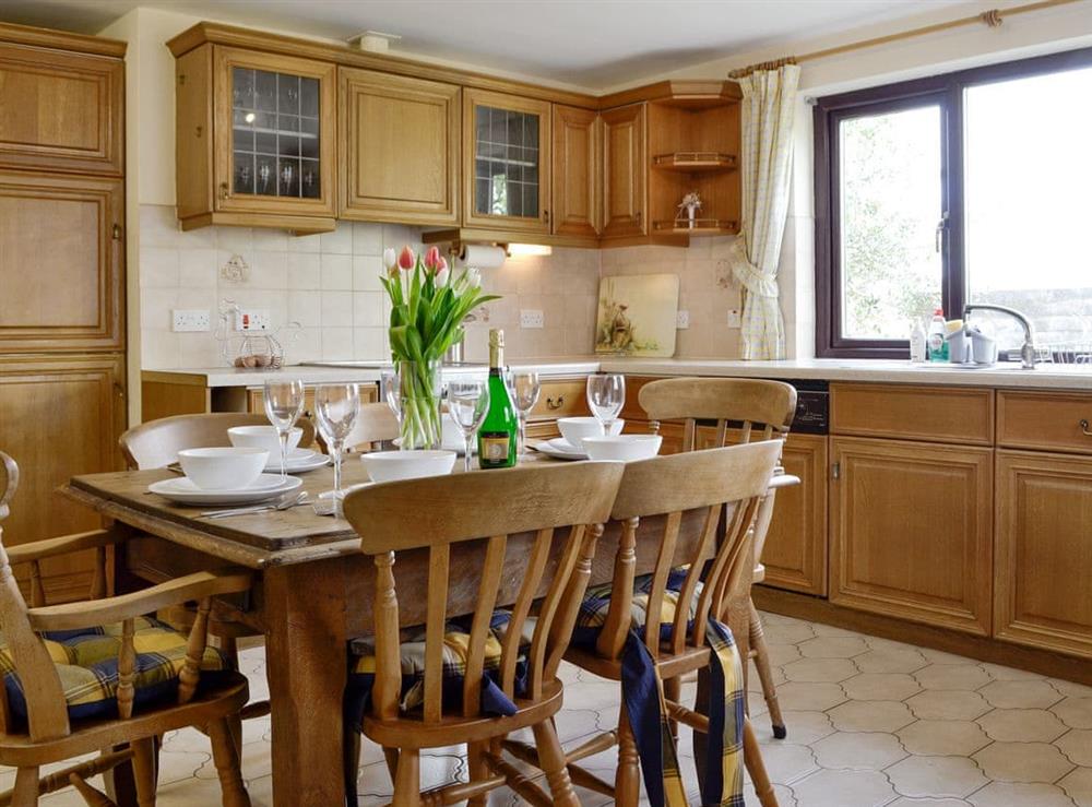 Well-equipped kitchen with dining areas at Three Views Bungalow in Talgarth, near Hay-on-Wye, Powys