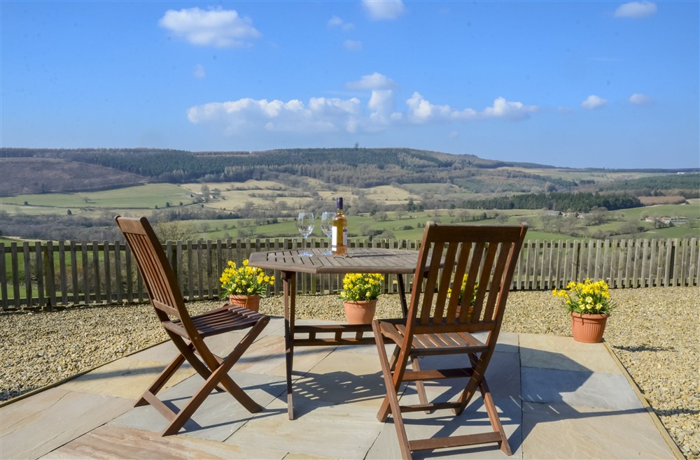 Outside seating area overlooking Bransdale at Threp'nybit Cottage, Pockley,  Helmsley, North Yorkshire