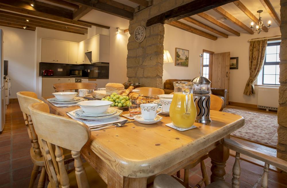 Dining area comfortably seating six guests at Threpnybit Cottage, Pockley