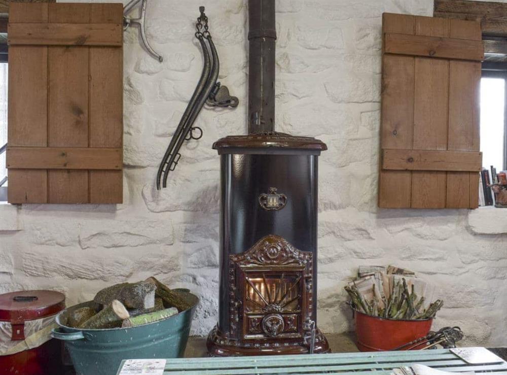 Warming wood burning stove at Threshing Barn in Glaisdale, Nr Whitby, North Yorkshire., Great Britain