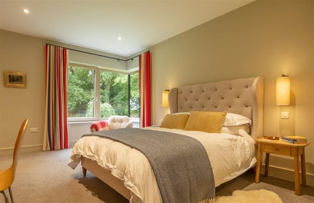 Ground floor: Bedroom four has a king-size bed at Thursford Castle, Great Snoring