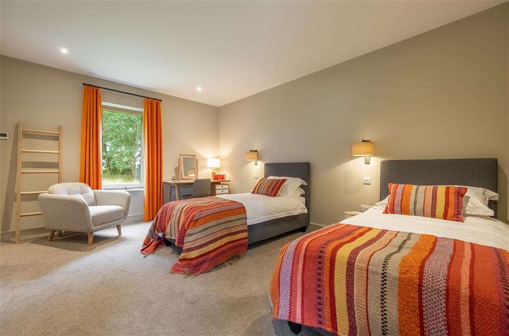 Ground floor: Bedroom three, twin room with en-suite bathroom at Thursford Castle, Great Snoring