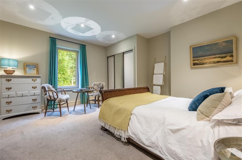 Ground floor: Bedroom two has a king-size bed at Thursford Castle, Great Snoring