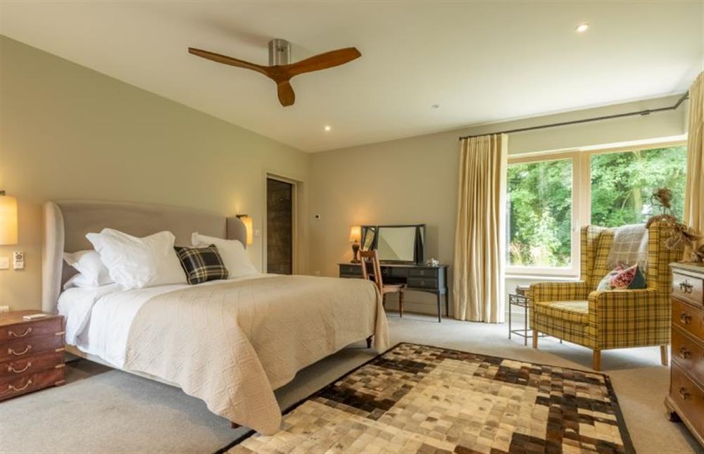 Ground floor: The master bedroom has a super-king size bed at Thursford Castle, Great Snoring