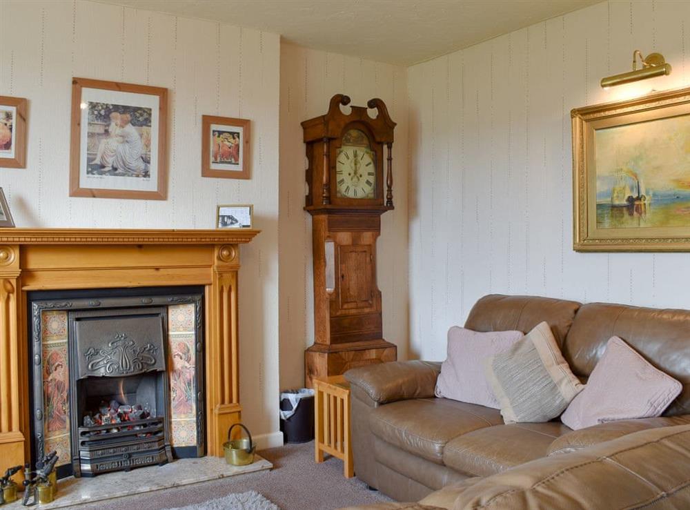 Delightful living room with an open fire at Thurston View in Coniston, Cumbria
