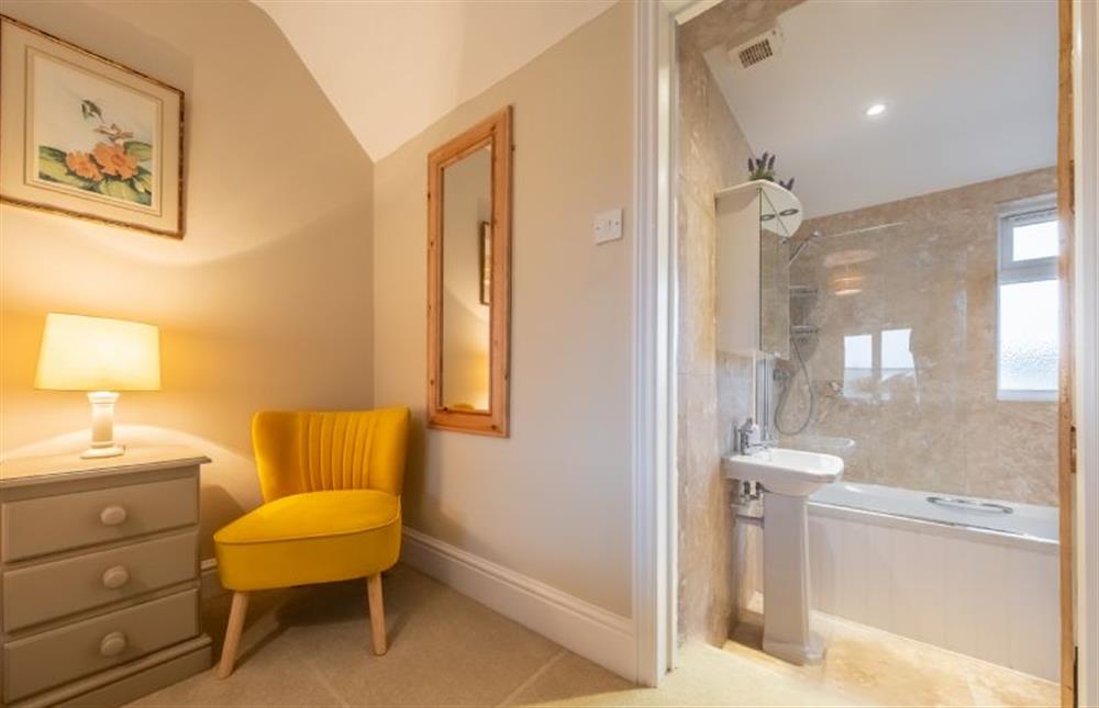 First floor: En-suite bathroom adjoining the master bedroom at Thyme Cottage, Thornham near Hunstanton