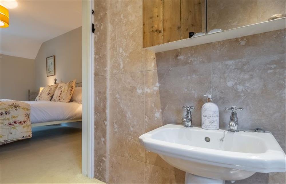 First floor: En-suite bathroom to master at Thyme Cottage, Thornham near Hunstanton