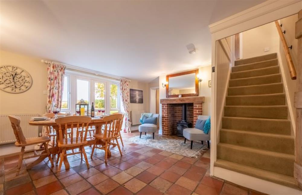 Ground floor: Stairs lead from the dining room to the first floor at Thyme Cottage, Thornham near Hunstanton