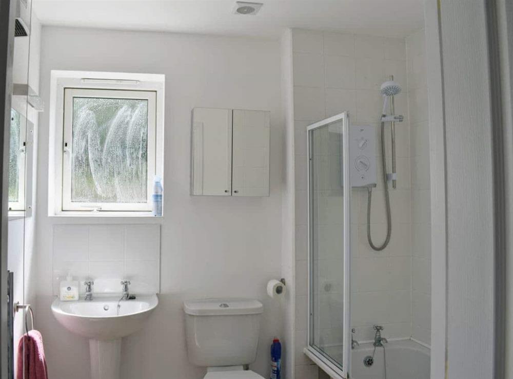 Bathroom with shower over bath at Tidal Retreat in Whitby, North Yorkshire
