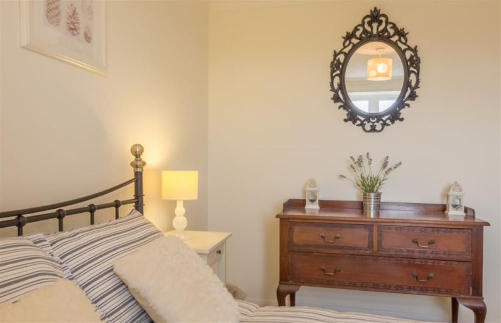 First floor: Bedroom one with dressing table at Tide Cottage, Holme-next-the-Sea near Hunstanton