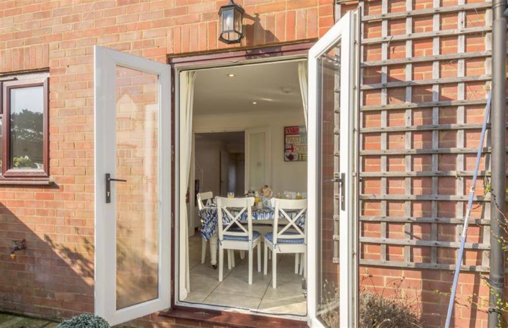 French doors lead from the kitchen into the garden at Tide Cottage, Holme-next-the-Sea near Hunstanton