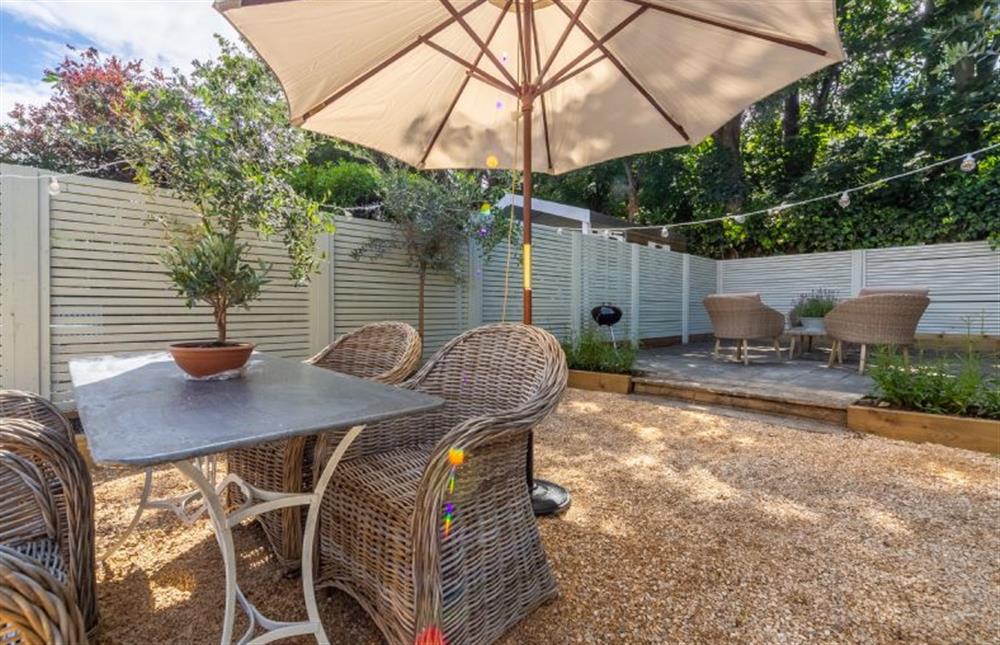 Exterior: Enjoy the sunny rear garden and terrace at Tide Cottage, Overstrand near Cromer