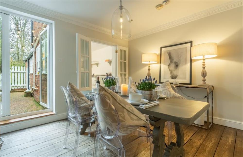 Ground floor: Dining room with french doors to south facing garden at Tide Cottage, Overstrand near Cromer