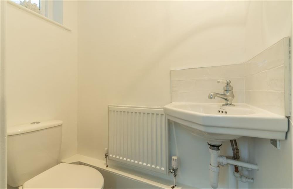Ground floor: WC with wash basin in shower room at Tide Cottage, Overstrand near Cromer