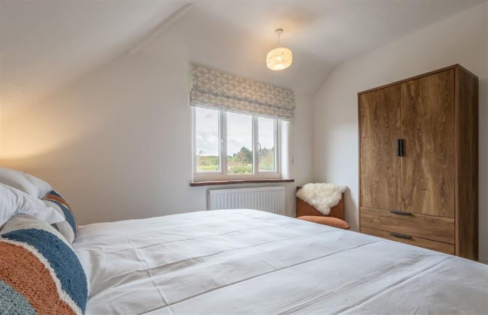 First floor: Master bedroom at Tide Cottage, West Runton near Cromer