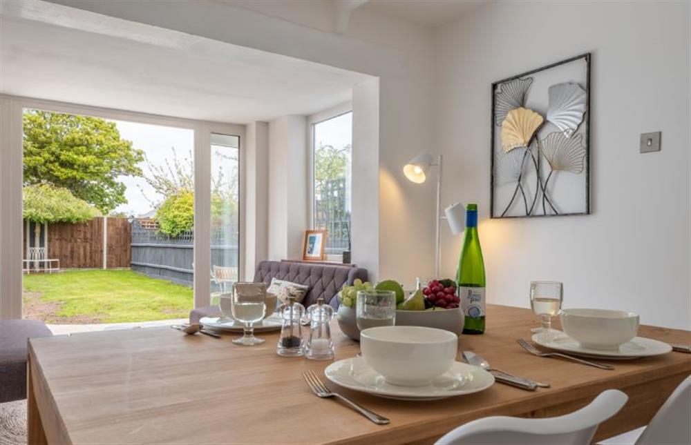 Ground floor: Dining room with french doors leading into the garden at Tide Cottage, West Runton near Cromer