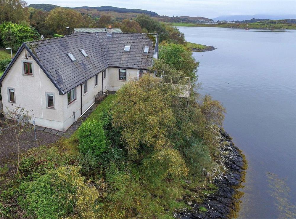 Stunning detached property is perched on the edge of the crystal clear waters of Loch Etive at Tidereach in Connel, near Oban, Argyll and Bute, Scotland