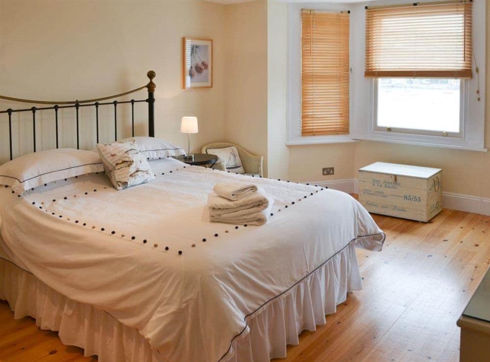 Delightful double bedroom with antique style bed at Tides Reach in Fowey, Cornwall., Great Britain