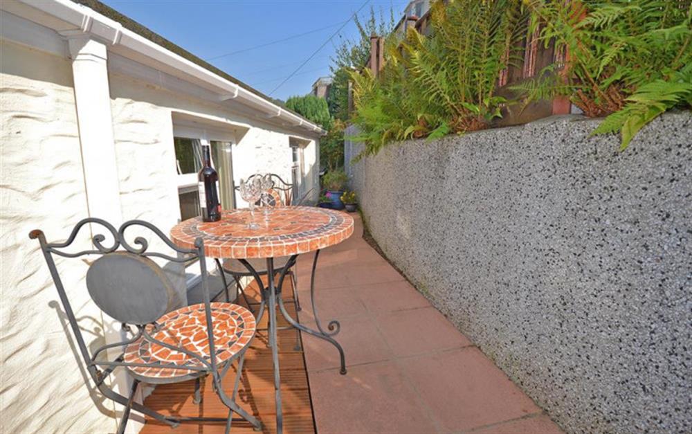 Bistro table and chairs in the sun. at Tideways Apartment in Looe