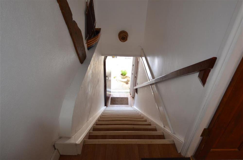 Stairs leading down from the apartment. at Tideways Apartment in Looe