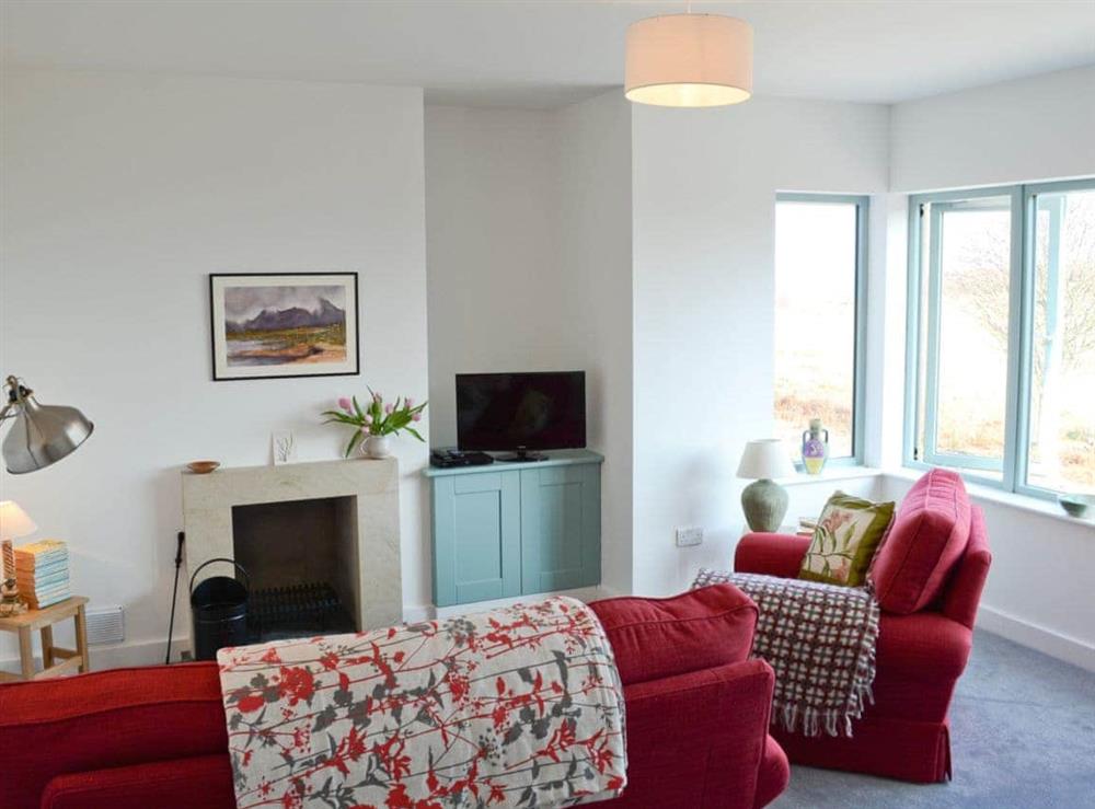 An extremely comfortable and cosy living room, which also enjoys panaromic views, is the perfect place to unwind at the end of the day. at Tigh An Iasgair in Fearnbeg, near Applecross, Ross-Shire