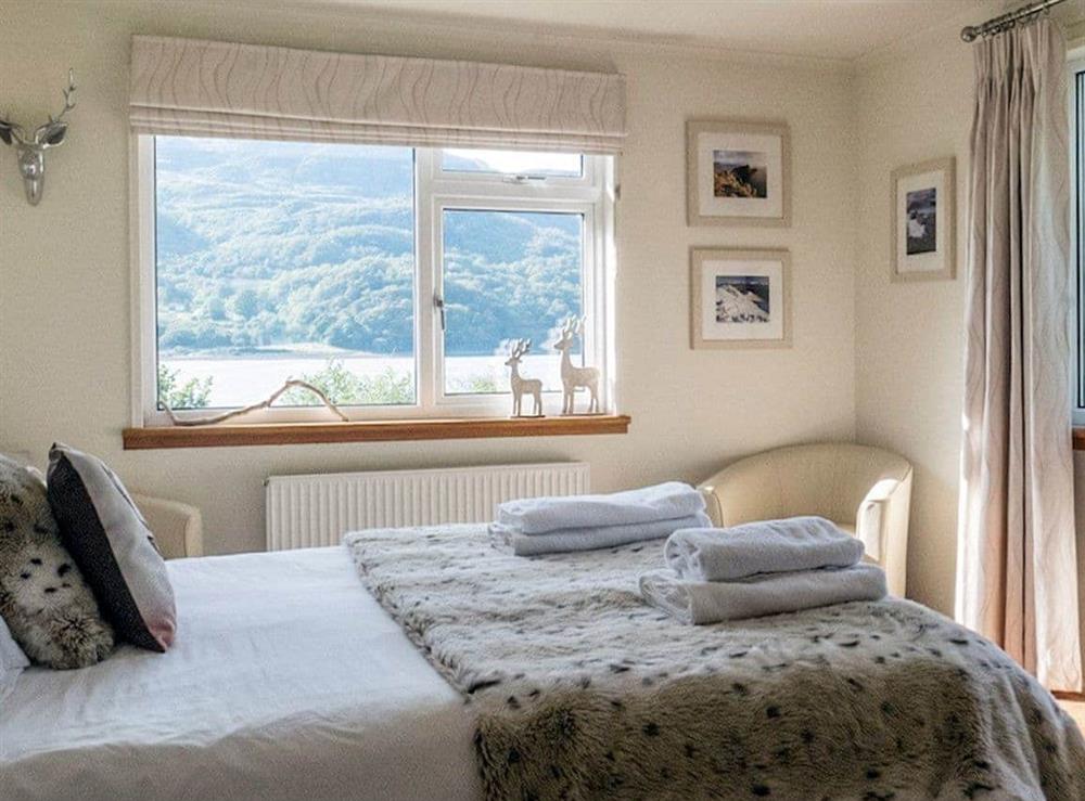 Master bedroom with spectacular views of the sea and the glen at Tigh-na-Creige in Colintraive, Argyll., Great Britain