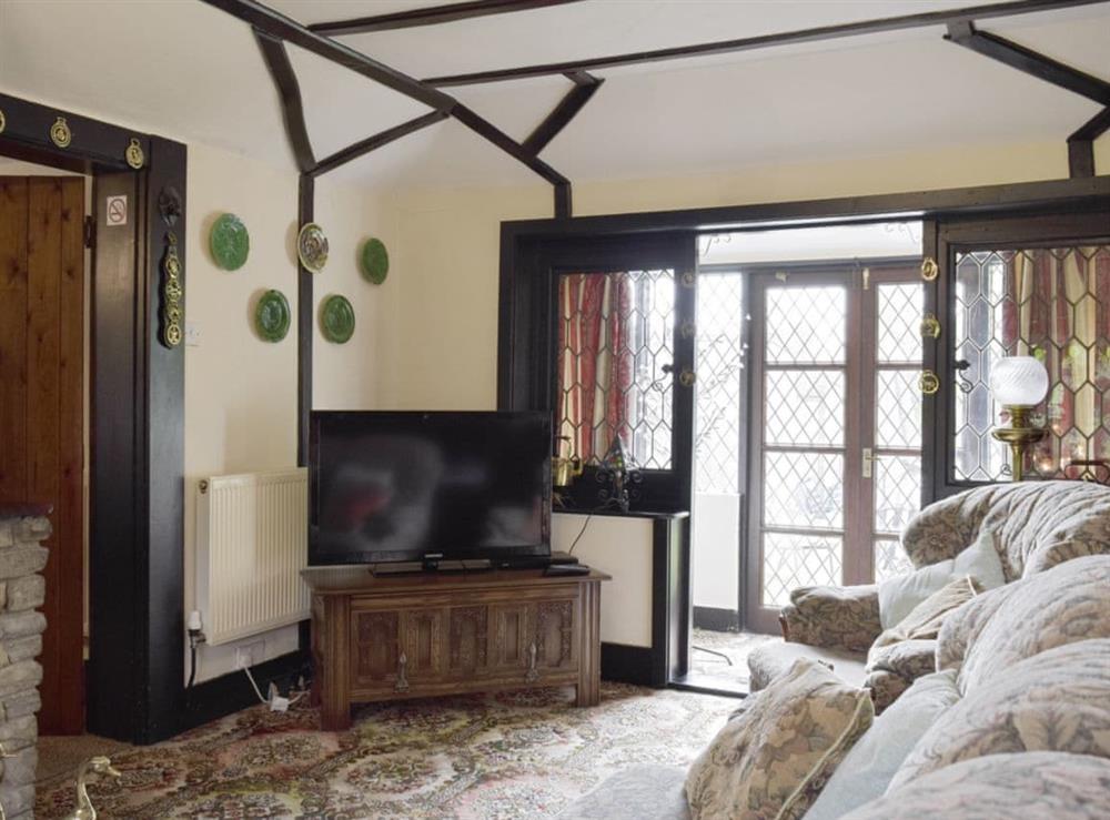 Charming living room with wood beams throughout at Tillet Cottage in Oulton Broad, near Lowestoft, Suffolk