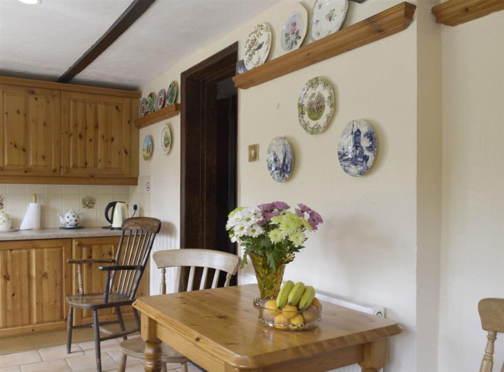 Intimate dining area within kitchen at Tillet Cottage in Oulton Broad, near Lowestoft, Suffolk