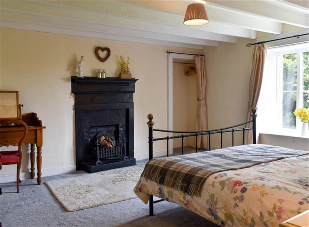 Spacious bedroom with kingsize bed and beams (photo 2) at Tillys Cottage in Goathland, Great Britain