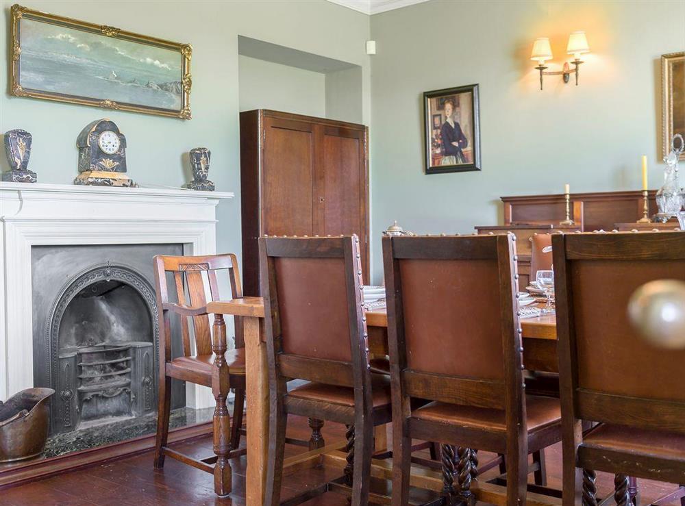 Cosy dining room with open fire at Tilney Hall in Kings Lynn, Norfolk