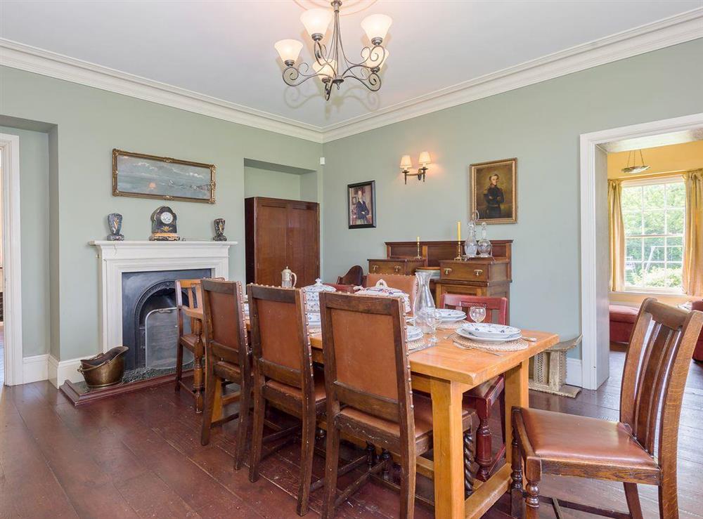 Large dining room with open fire at Tilney Hall in Kings Lynn, Norfolk
