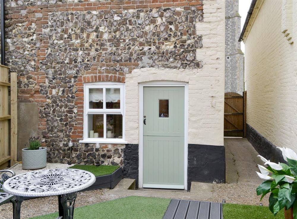Characterful rear courtyard area at Time Cottage in Coltishall, near Wroxham, Norfolk, England