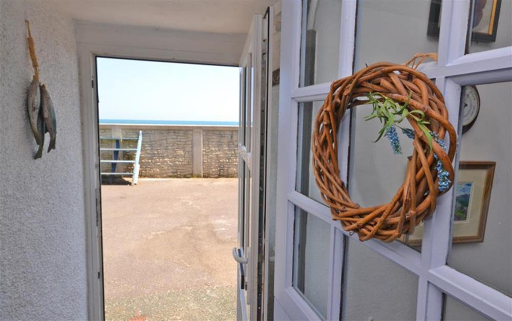 Front door straight out to the sea wall with views of the sea. at Tinsey Cottage in Beesands