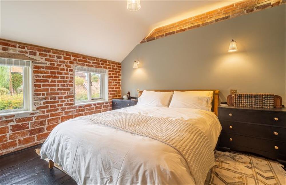 Bedroom one with 5’ king size bed at Tipple Cottage, Peasenhall