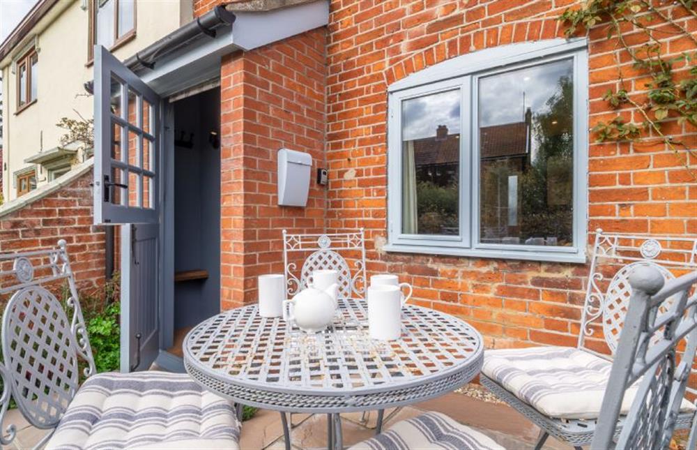 Front entrance to Tipple Cottage  with outdoor bistro table  at Tipple Cottage, Peasenhall