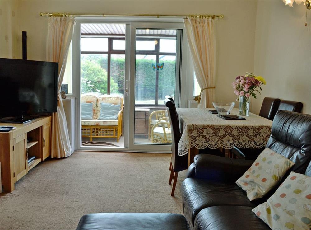 Welcoming living/dining room at Tir Nani Ogg in Towyn, near Rhyl, Conwy