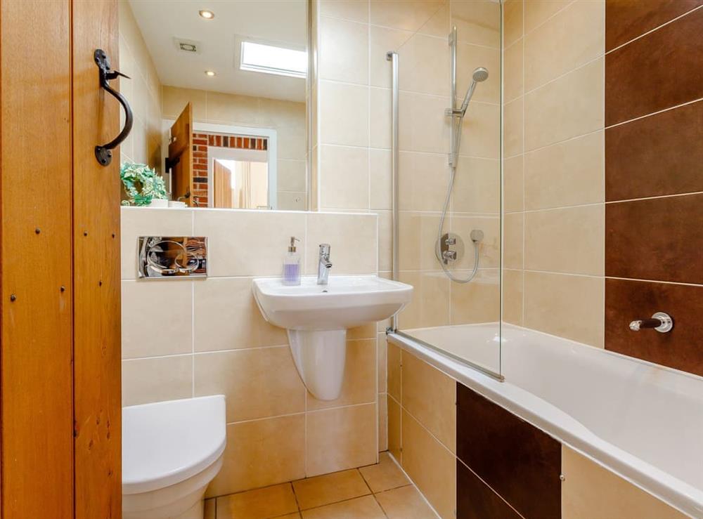 En-suite Bathroom with shower over bath (photo 2) at Tissington Ford Barn in Bradbourne, Derbyshire