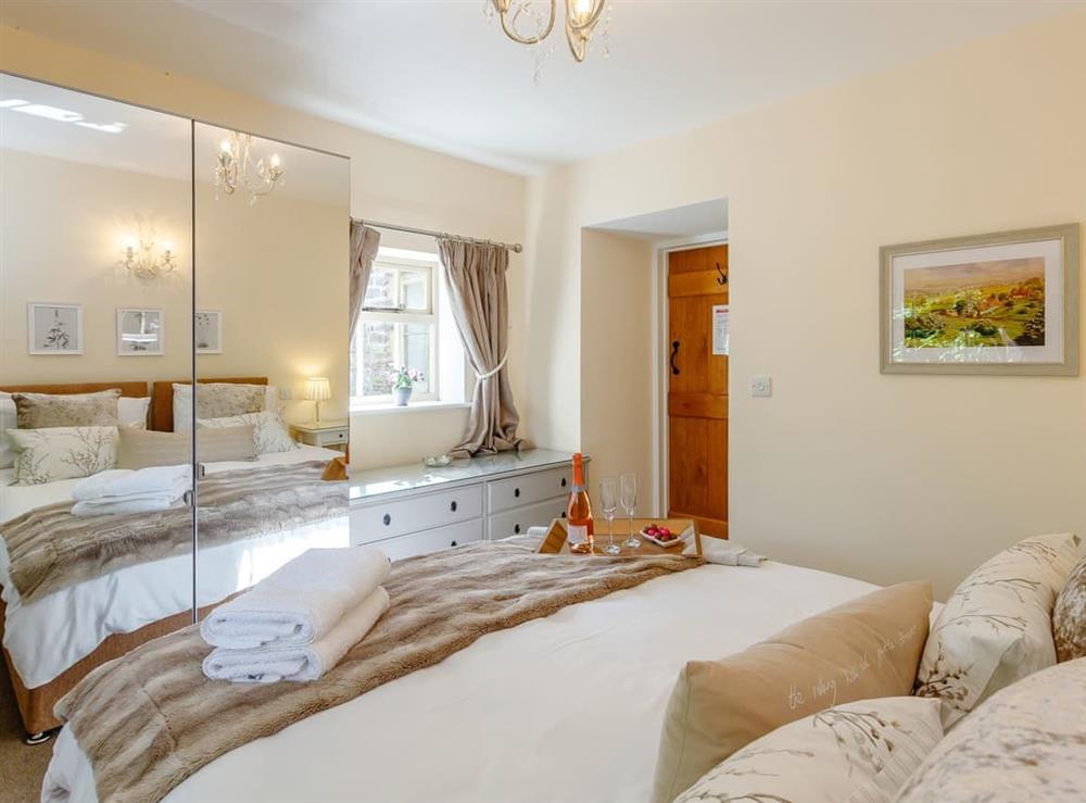 Mirrored storage within en-suite double bedroom at Tissington Ford Barn in Bradbourne, Derbyshire