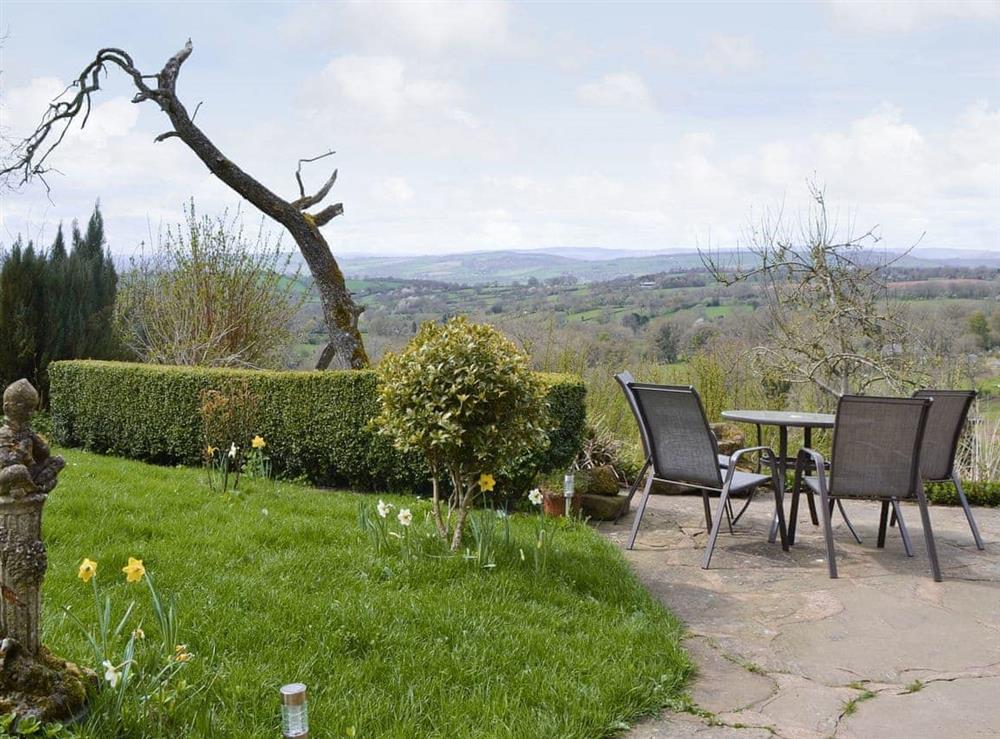 Patio with outdoor furniture at Titchbourne Cottage in Clee St Margaret, near Ludlow, Shropshire