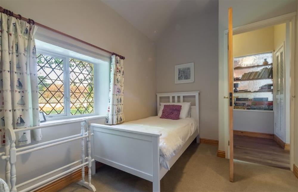 Ground floor: Single bedroom with leaded glass windows  at Toad Hall, Burnham Deepdale near Kings Lynn