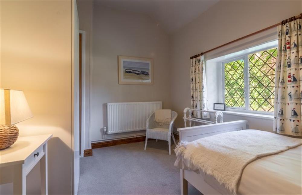 Ground floor: Single bedroom with leaded glass windows at Toad Hall, Burnham Deepdale near Kings Lynn