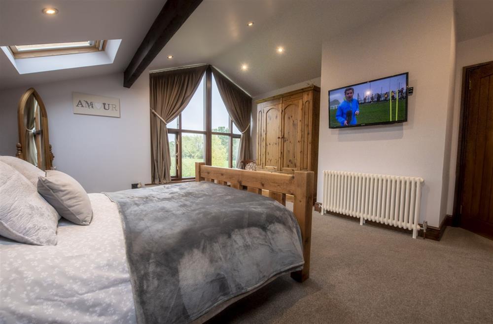 Bedroom one boasts views of the surrounding countryside at Tockwith Lodge Barn, York