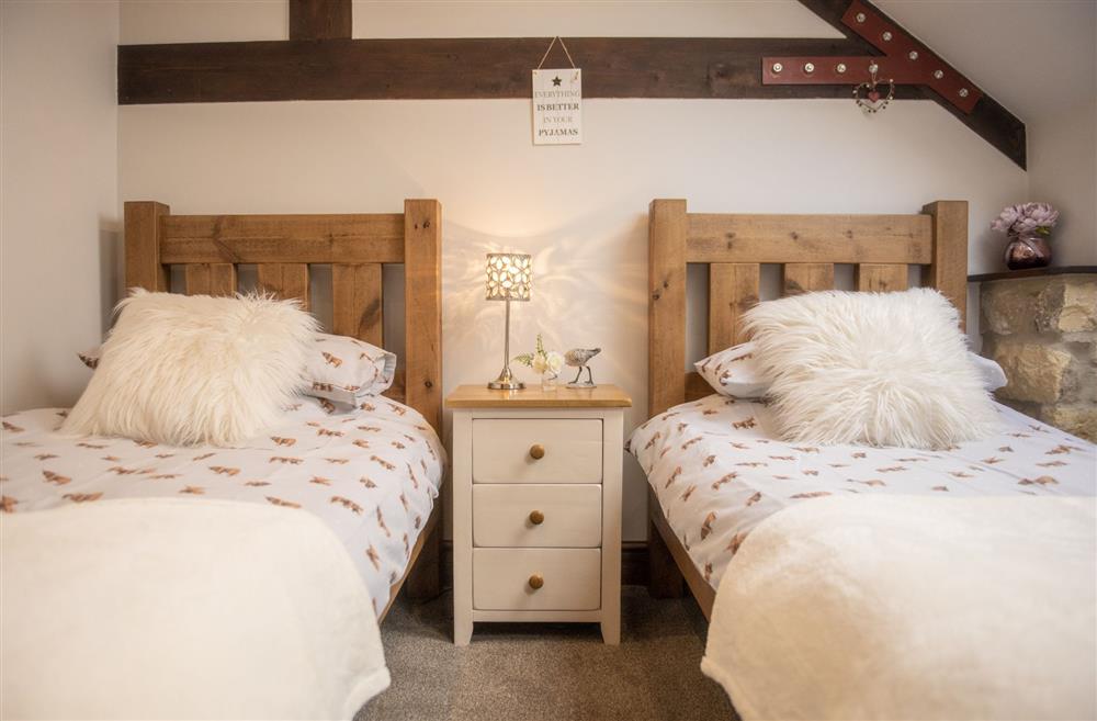Bedroom two nestled in the eves at Tockwith Lodge Barn, York