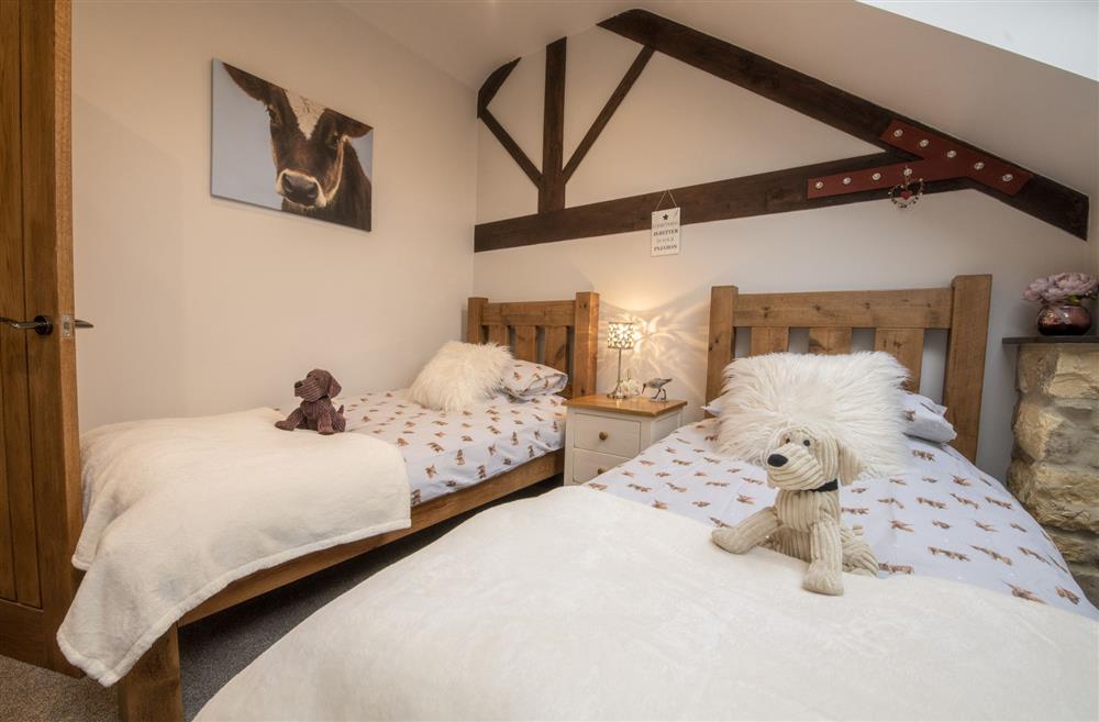 Bedroom two with twin 3’ single beds at Tockwith Lodge Barn, York