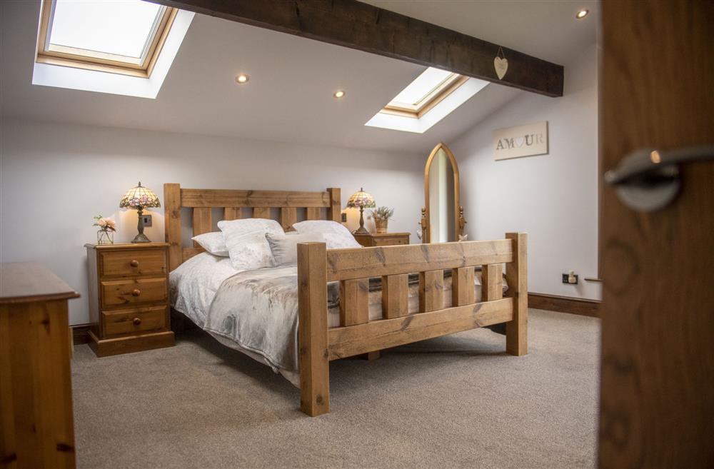Spacious bedroom one at Tockwith Lodge Barn, York
