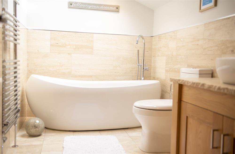 The freestanding bath with handheld shower attachment at Tockwith Lodge Barn, York