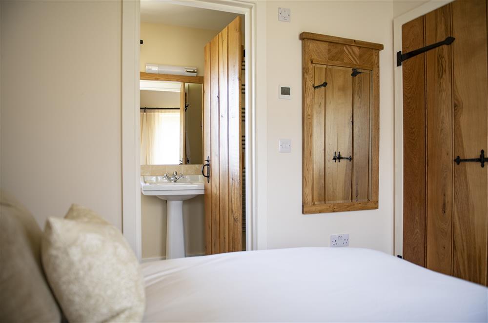 Bedroom leading to the en-suite shower room at Todd Hills Hall Farmhouse and Vale Croft, Melmerby
