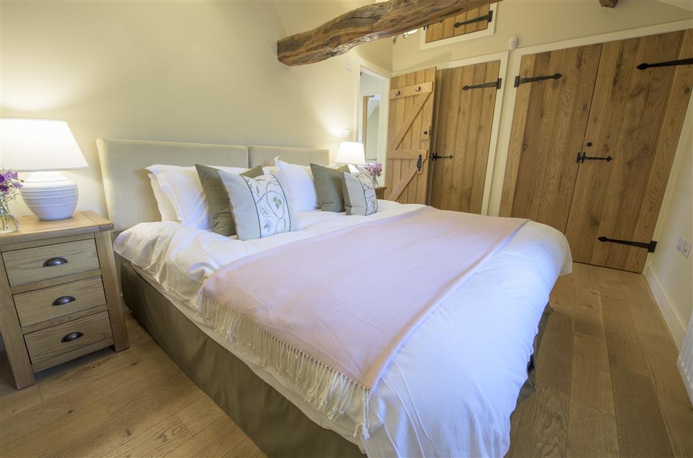 Bedroom two with a 6’ zip and link double bed and en-suite shower room at Todd Hills Hall Farmhouse and Vale Croft, Melmerby